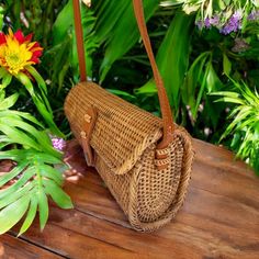 Hand-crafted from natural rattan, this rectangular handbag/clutch showcases a snap closure and adjustable crossbody strap for versatile use. Its fabric lining adds an extra touch of durability and versatility. Natural Rattan Size: Length: 8-1/8 | Depth: 3 inches | Height - 5 inches Snap Closure Rectangular Brown Strap Color: Natural Rattan Handbags, Clutch Purse, Clutch Handbag, Hand Weaving, Handbags, Fabric, Color