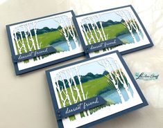 three cards with trees on them sitting next to each other