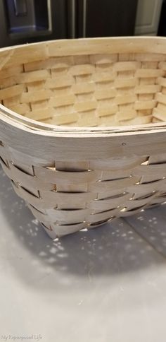 a wooden basket sitting on top of a counter