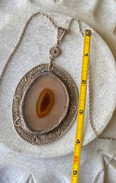 Stunning Art Nouveau Sterling Silver Filigree Sliced Agate Vintage Antique Necklace Pendant is much older then the chain. Chain measures 24 inches around, can be placed on a shoter chain by request See pendant next to ruler for scale Weighs 29.1 grams Elegant Agate Necklace With Large Pendant, Formal Oval Agate Necklace, Antique Carnelian Pendant Necklace, Elegant Engraved Agate Jewelry, Antique Oval Necklace With Natural Stones, Vintage Necklace With Oval Pendant And Natural Stones, Formal Agate Jewelry With Engraving, Elegant Carnelian Necklace With Large Pendant, Oval Agate Necklace With Large Pendant