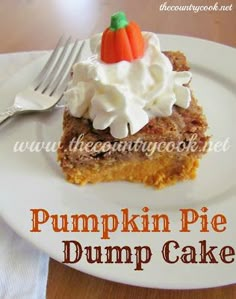 pumpkin pie dump cake on a white plate with whipped cream and a fork next to it