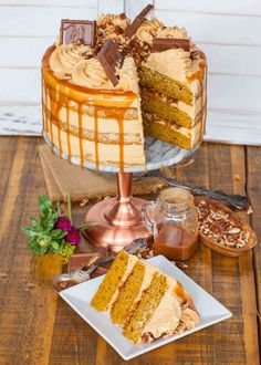 there is a cake on the table with two slices cut out and ready to be eaten