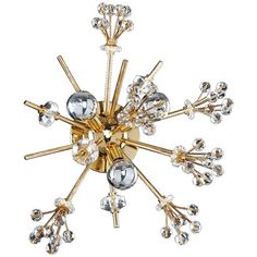 a gold and crystal chandelier on a white background