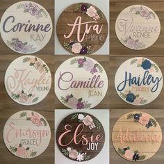 six round wooden signs with floral designs on the front and back, all in different colors