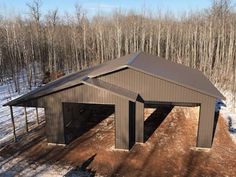 an overhead view of a two car garage in the middle of a snow covered field