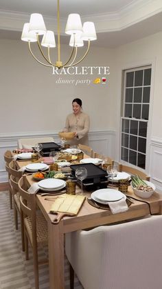 a man standing in front of a table with plates and food on top of it