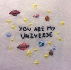 an embroidered t - shirt with the words you are my universe on it