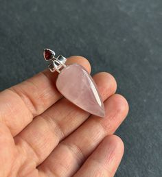 "Natural  Rose Quartz and Garnet 925 sterling silver pendant that is 1.77\" in height.  ✓You'll receive your new pendant with the signature gift box  ✓ Natural Genuine Rose Quartz from Madagascar and Garnet  ✓ Solid 925 Sterling Silver (925 parts per 1000) ✓ Silver Hallmark on every item ✓ Every natural stone is different and exclusive in pattern and shape, and with its unique properties." Rose Gemstone Jewelry As A Gift, Rose Gemstone Jewelry For Gift, Sterling Silver Necklace Pendants, Quartz Rose, Green Tourmaline, Silver Pendant Necklace, Sterling Silver Pendant, Madagascar, Stone Pendants