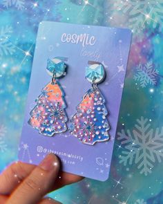 "This listing is for ONE Pair of Iridescent Christmas Tree Earrings.   Posts are hypoallergenic. If you wish to replace hardware to ball posts or hooks please leave me a note at checkout. Earrings are 2\" Follow me on IG for shop updates! @shopcosmiclovely Subscribe to my newsletter for exclusively monthly coupons! You can subscribe at: cosmiclovely.com" Ear Dressing, Iridescent Christmas Tree, Glowforge Earrings, Iridescent Christmas, Journal Bullet, Laser Ideas, Winter Earrings, Winter Tree, Tree Earrings