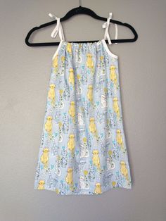 Childs summer dress featuring  summer cats with friends - birds and flowers Size 4 childrens dress tie straps gathered neckline wear with or without shirt underneath wear with or with out shorts or pants as weather changes Cats have silly fur patterns of flowers leaves or spots machine washable Summer dress with season long wearability Playful Sleeveless Dress With Tie Straps, Fun Summer Dresses For Sleepovers, Fun Summer Dresses For Sleepover, Fun Summer Sleepover Dresses, Cute Dresses With Spaghetti Tie Straps, Cute Bedtime Dresses For Summer, Cute Summer Dress With Bunny Print, Summer Cats, Pattern Summer Dress