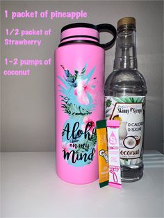 a pink water bottle next to an aloh nourishment bottle and some other items