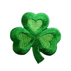 four leaf clover with a heart on it's center in the shape of a shamrock