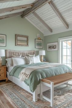 a bedroom with a bed, dresser and two windows in it's center area