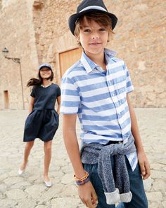 J.Crew boys secret wash shirt, shawl-collar toggle sweater, sideline pant in chambray, straw trilby hat with stripe band, and neon cord bracelet. Kid Illustration, Trilby Hat, Boys Wear, Stylish Boys