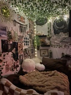 a bedroom with lots of pictures and lights on the wall, including a teddy bear