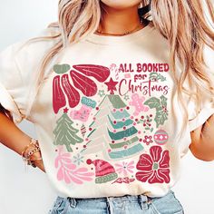 a woman wearing a t - shirt that says, all cooked christmass on it