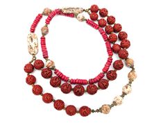 A beautiful vintage coral and carved red Chinese cinnabar double strand necklace accented with natural stone beads. Great condition with a dark patina on the gold accent beads.  Measures 24" (shortest strand) Weighs 6.2 ounces UUS SHIPPING: US orders over $35 or for 3 or more items ship free via first class mail. Orders over $150 receive a free priority mail upgrade. Expedited shipping is available. SHIPPING OUTSIDE THE US:  We combine shipping on multiple item orders.  Expedited shipping is ava Vintage Red Wooden Beads, Vintage Double Strand Gemstone Beads Necklace, Carved Red Vintage Jewelry, Red Carved Vintage Jewelry, Red Vintage Hand-strung Jewelry, Vintage Red Coral Single Strand Beaded Necklace, Vintage Red Gemstone Beads, Vintage Single Strand Red Coral Beaded Necklace, Vintage Single Strand Red Coral Beaded Necklaces