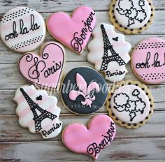 decorated cookies with the eiffel tower and paris in pink, black and white