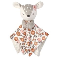 a stuffed animal with flowers on it's blanket