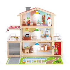 a wooden doll house with furniture and accessories