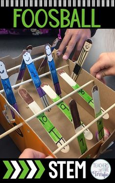 a cardboard box filled with toothpicks and some writing on them that says football