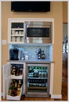 an open refrigerator and microwave combination in a kitchen