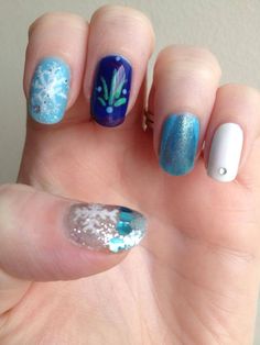 Frozen theme nails Elsa Frozen Nails, Frozen Nails For Kids, Disney Frozen Nails Acrylic, Disney Frozen Nail Designs, Nail Art Christmas, Snowflake Nail Design, Theme Nails