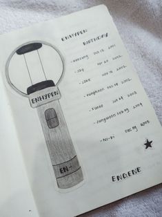 an open book with a drawing of a lantern on it