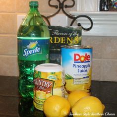 lemons, pineapple juice, and other ingredients on a counter top next to a bottle of soda