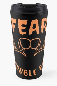 a black and orange travel mug with the words fear double blind on it's side