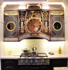 a kitchen with an oven, stove and clock on the wall