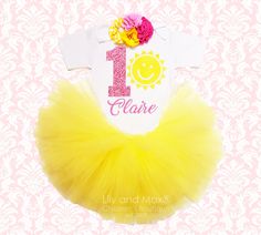 "YOUR ARE MY SUNSHINE BIRTHDAY TUTU SET \" FREE STANDARD SHIPPING IN USA!\" TOP: Premium quality bodysuit or shirt professionally heat pressed No- shed glitter vinyl in \" Your little one's name + any number+ sun silhouette\" S/S= Short Sleeves L/S= Long Sleeves FLOWER HEADBAND: Matching FLOWER headband embellished with shabby and JEWELED flowers. ( if you need it on hard headband or on alligator clip, please leave a note to seller during checkout) TUTU: We use all high quality made in USA tulle Mermaid Birthday Outfit, Sun Silhouette, Jeweled Flowers, Yellow Tutu, Unicorn Birthday Outfit, Sunshine Party, Mermaid Headband, Outfit Yellow, Unicorn Party Favors