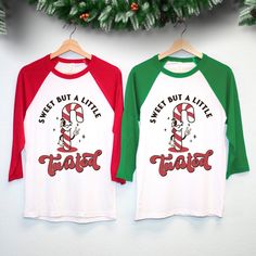 "\"Sweet But A Little Twisted\" Candy cane Women's Christmas Shirt Baseball Tee This shirt combines festive charm with a touch of humor, making it the perfect choice for those who love to add a twist to their holiday style. 🍭🎄 Available In Sizes S, M, L, Xl, 2Xl  These Run True To Size. We Recommend Sticking With Your Normal Shirt Size For These  Color: Red Sleeves, Green Sleeves Cotton & Polyester Blend Very Soft And Comfy Thank you so much for viewing this listing. Communication is my top pr Ugly Christmas Shirts, Christmas Clothes, Womens Christmas Shirts, Holiday Style, Christmas Candy Cane, Baseball T Shirts, Christmas Women, Holiday Fashion, Christmas Shirt