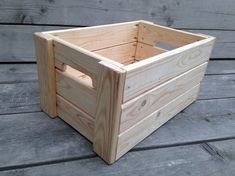 a wooden crate sitting on top of a wooden floor