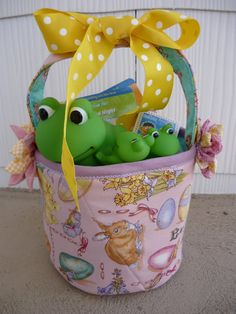 a basket filled with toys sitting on top of a cement floor