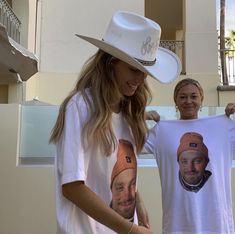 two women standing next to each other wearing t - shirts with pictures of them on them