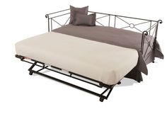 a bed with a metal frame and mattress on it