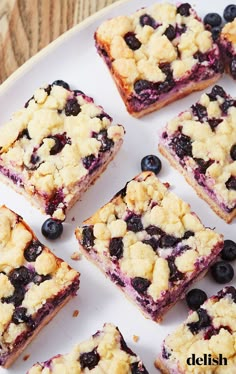 blueberry crumb bars on a white plate