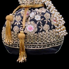 A perfect blend of Indian intricacy and Iranian design! This stunning pouch bag is dazzled with zardozi embroidery, sequins work and pearl moti with tassel finishing in the end. In-stock & ready-to-ship. *Please note, The placement of the embellishments may vary slightly as each bag is handmade and has unique qualities each time it is remade. We use faux stones and beads in all of our jewelry. Iranian Design, Zardozi Embroidery, Diwali Sale, Embroidered Handbag, Faux Stone, In The End, Classy Women, Pouch Bag, Hand Embroidered