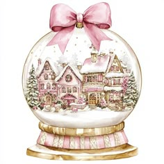 a christmas ornament with a pink bow and houses in the snow on it