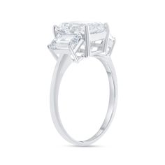 Say "Hello!" three times with this gorgeous Emerald Cut 3-stone Cubic Zirconia Engagement Ring that will keep the sparkle through the engagement and into a successful marriage. Product Information Metal Type: Available in 10k or 14k Weight: 10k - 1.5 g | 14k - 1.6 g Stone InformationEmerald Cut 3-stone Cubic Zirconia:Center Stone: 1 pc 9x7Side Stones: 2 pc 6x4 SKU: TK6102 3 Stone Engagement Ring, Cubic Zirconia Engagement Rings, 3 Stone Engagement Rings, Successful Marriage, Stone Engagement Ring, Stone Engagement Rings, Stone Engagement, Three Stone, Cut Design