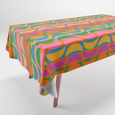 an image of a colorful tablecloth on a white background that looks like it has wavy lines