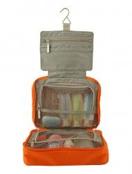 an orange suitcase filled with toiletries on top of a white background