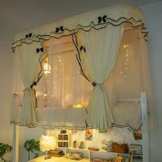 a bed room with a white table and curtains on the window sill above it