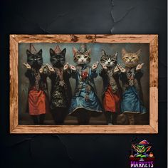 a group of cats standing next to each other in front of a wooden framed photo