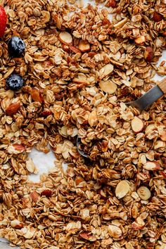 granola with blueberries and strawberries on top