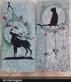 two cards with animals on them, one is black and the other has red berries