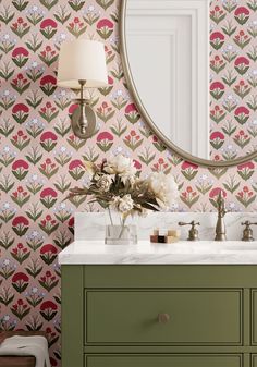 a bathroom vanity with a mirror and flower wallpaper on the wall next to it