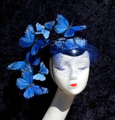 "A dramatic feather butterfly fascinator hat perfect for all sorts of special occasions, derby, ascot, and races. Made to order, you can choose your colors. This headpiece features hand-cut and hand-placed butterfly wings made out of feathers. Disguised into the pattern are small hearts. There is also a dramatic wired, face-framing \"arm\" that is adjustable and allows you to customize your look. The butterflies are individually wired to this arm. Also attached is a matching veil. One side is se Butterfly Fascinator, Feather Butterfly, Feather Painting, Cocktail Hat, Fascinator Hat, Pillbox Hat, Fascinator Hats, Pill Boxes, Derby Hats