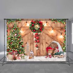 a christmas scene with presents and decorations on the wall in front of a wooden door